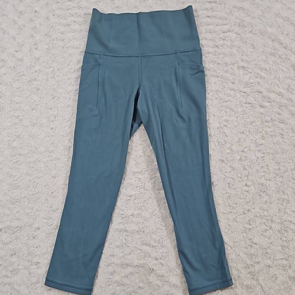 Athleta womens XXS light blue salutation stash pocket II Capri teal gym workout
